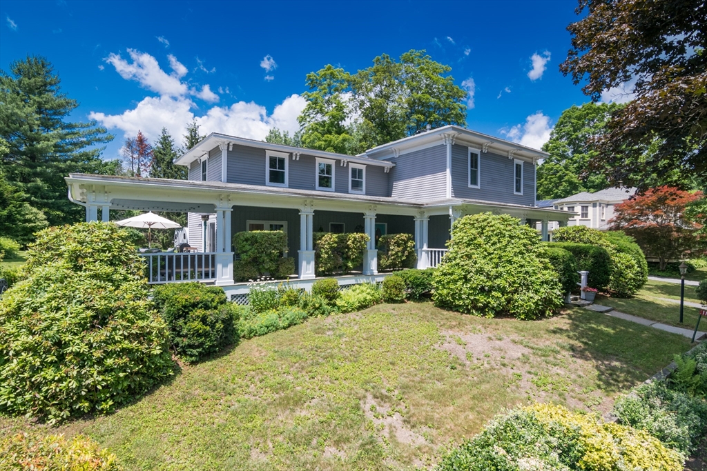 116 High Street Amherst, MA 01002 - Photo 1 of 42 a view of a house with a yard and potted plants
