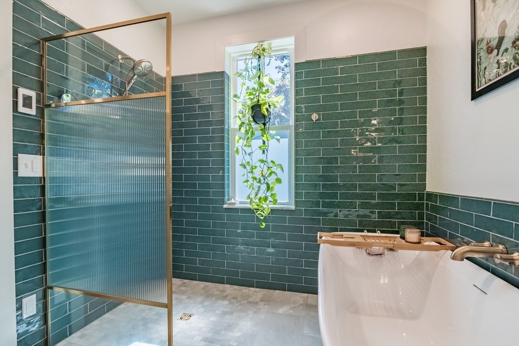 116 High Street Amherst, MA 01002 - Photo 21 of 42 a bathroom with a bathtub and shower
