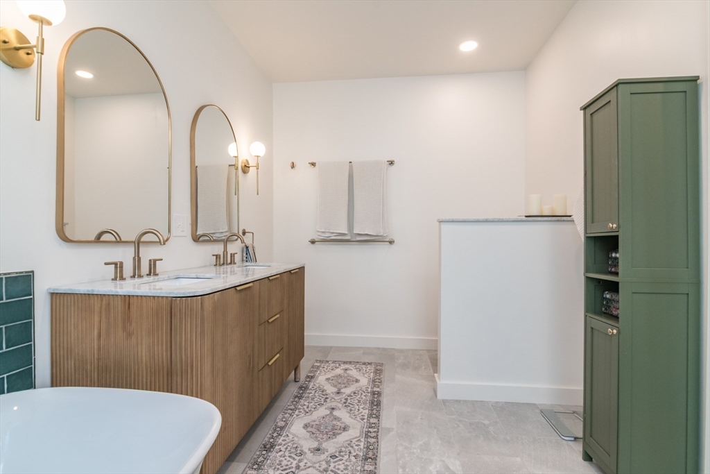 116 High Street Amherst, MA 01002 - Photo 22 of 42 a bathroom with a sink a toilet and shower
