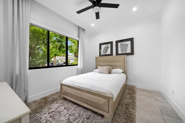 a view of a patio with table and chairs and wooden floor