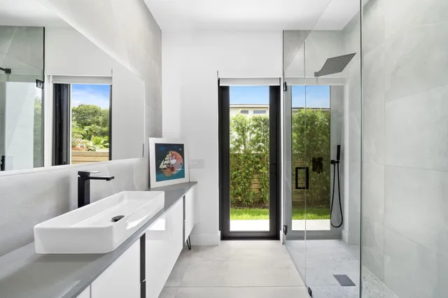 a living room with furniture and a dining table with kitchen view