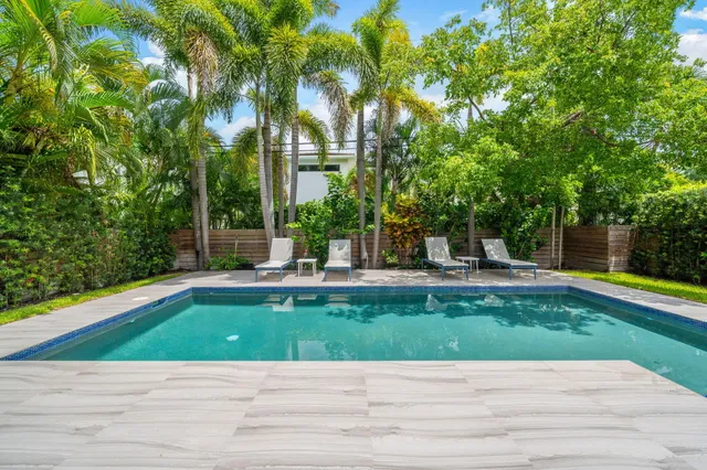 a view of wooden floor and windows in a room