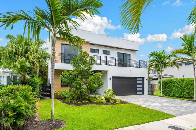 a large bedroom with a bed and a large window