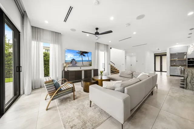 a bedroom with a large bed and a large window