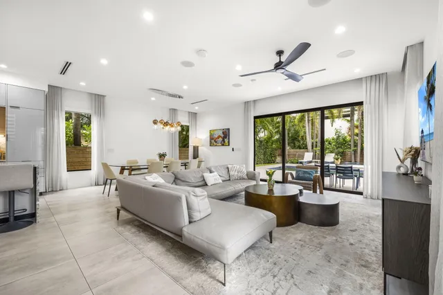 a spacious bedroom with a bed and a ceiling fan