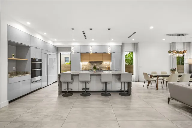 a bathroom with a double vanity sink a mirror and shower