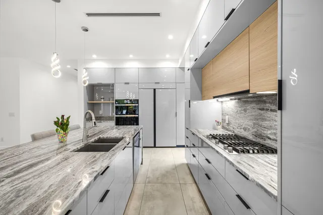 a spacious bedroom with a bed and a couch