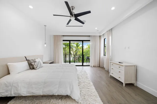 a spacious bathroom with a double vanity sink and a bathtub