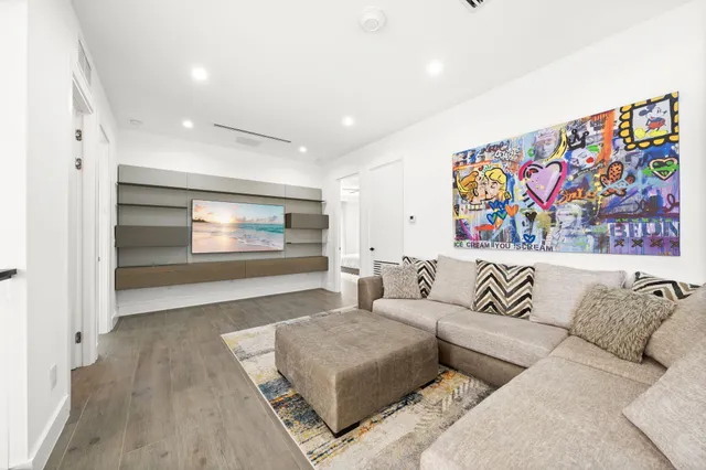 an aerial view of a house with a yard and garden