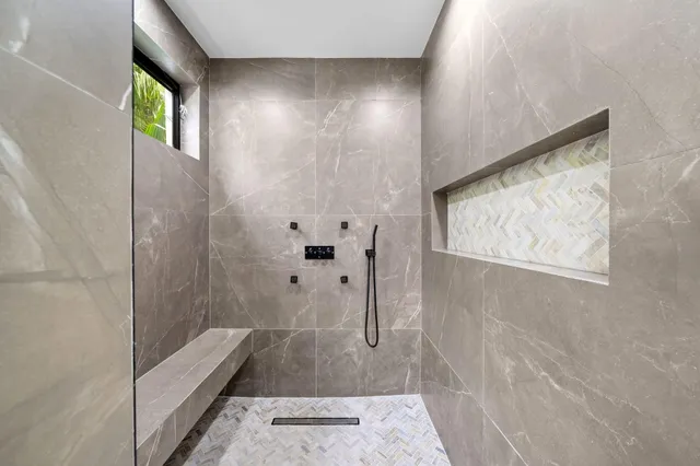 a view of two chairs in a balcony with wooden floor