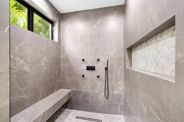 a picture of a hallway with wooden floor and stairs