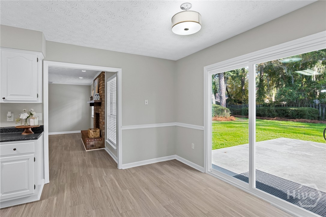 1106 Oakleaf Drive Savannah, GA 31410 - Photo 14 of 30 Kitchen eating area with new sliding glass door to expanded patio area