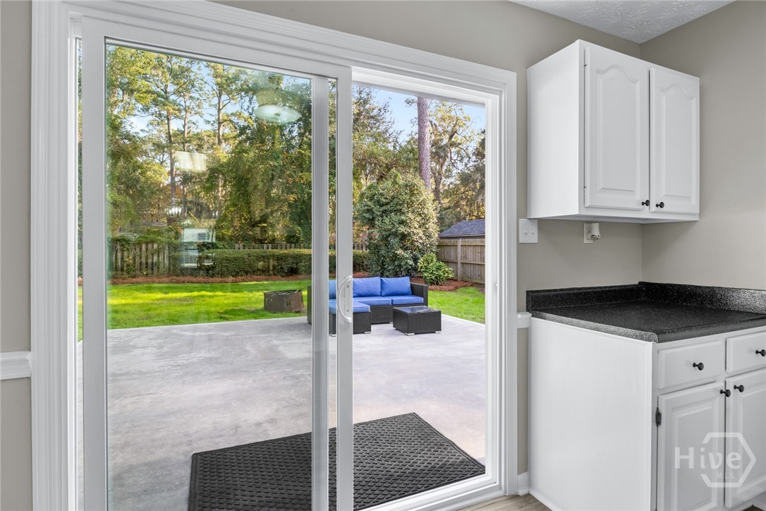1106 Oakleaf Drive Savannah, GA 31410 - Photo 26 of 30 New sliding glass doors to large patio and backyard