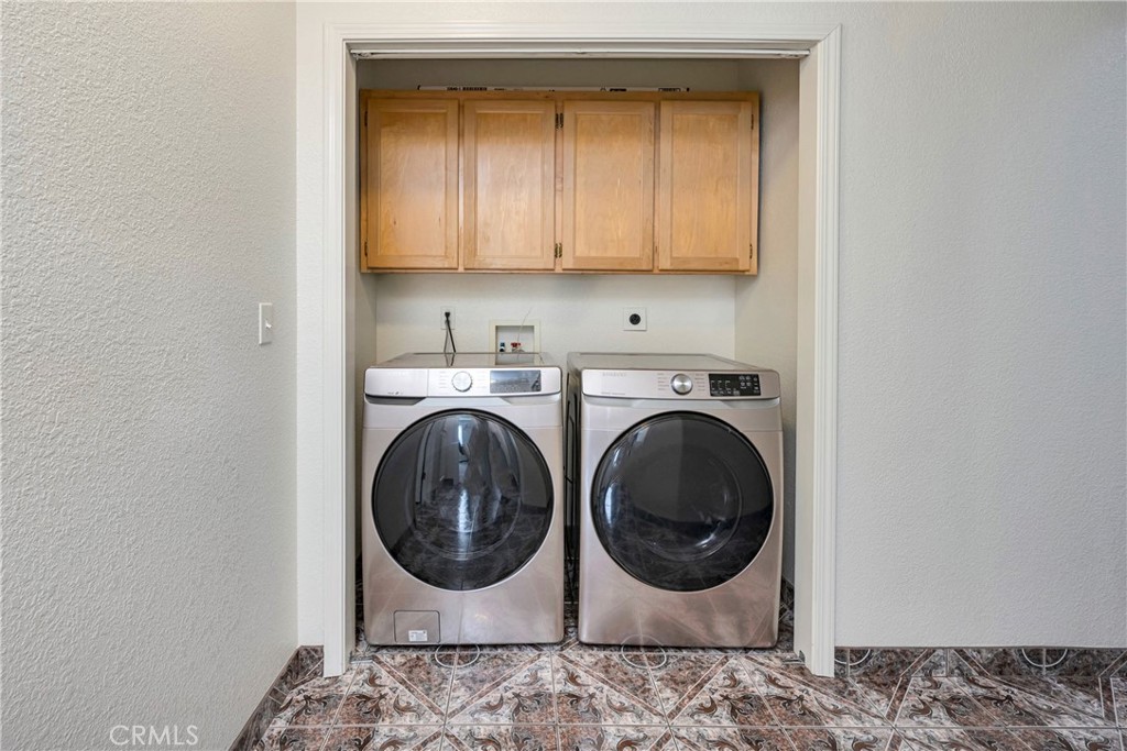 18230 Hidden Valley Road Hidden Valley Lake, CA 95467 - Photo 18 of 22 a utility room with dryer and washer