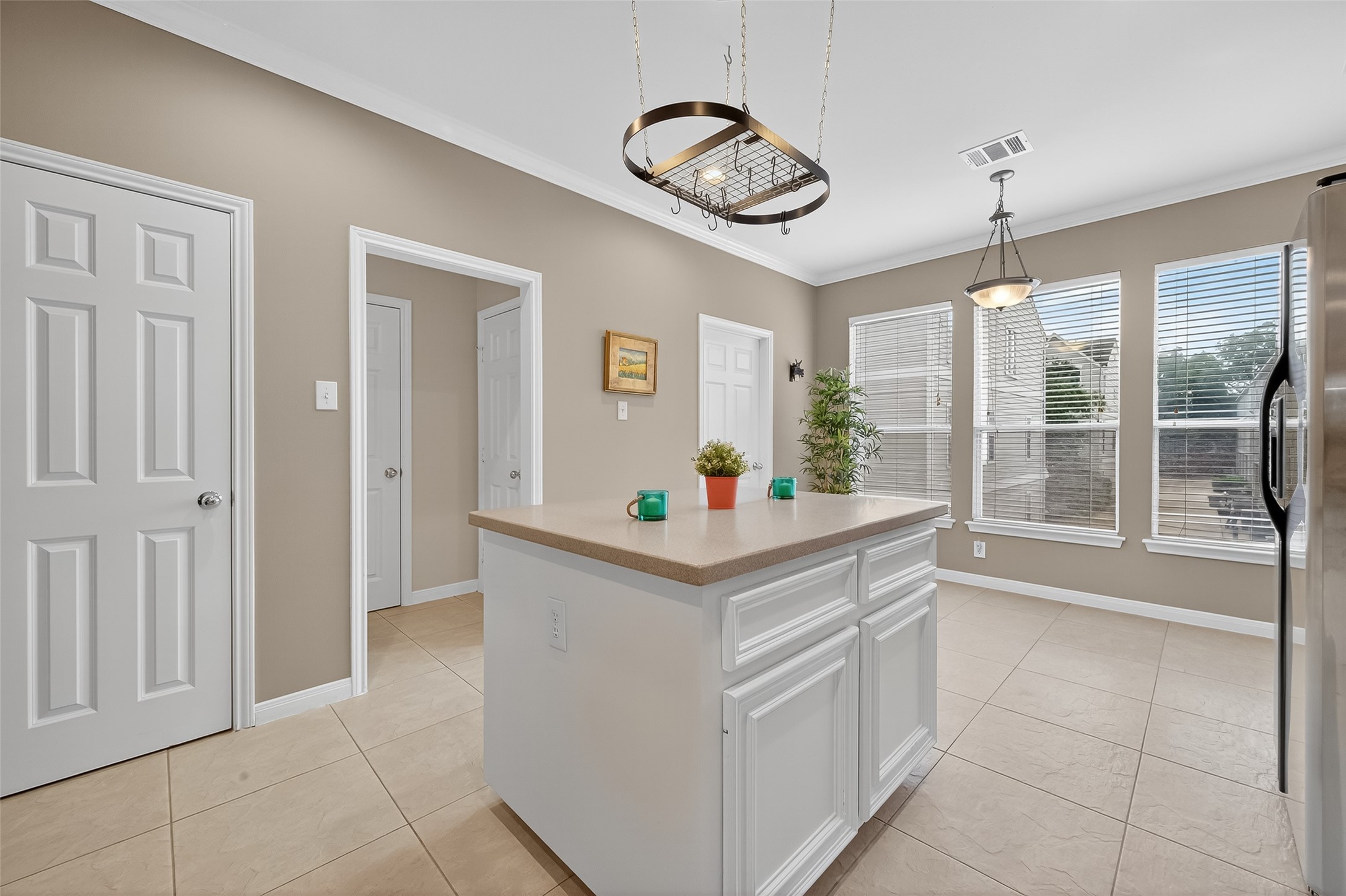 2913 West Dallas Street Houston, TX 77019 - Photo 16 of 34 a kitchen with stainless steel appliances granite countertop a stove and a chandelier