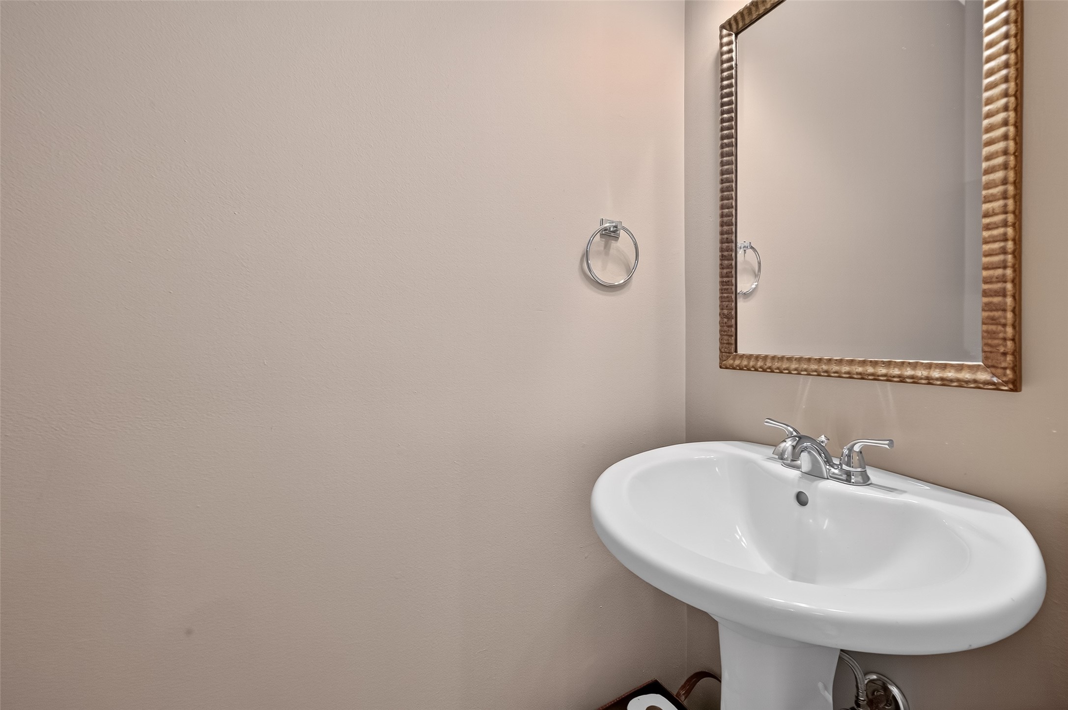 2913 West Dallas Street Houston, TX 77019 - Photo 17 of 34 a bathroom with a sink and a mirror