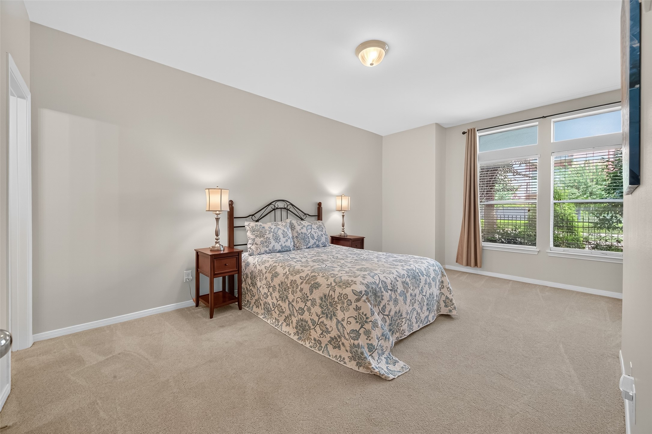 2913 West Dallas Street Houston, TX 77019 - Photo 18 of 34 a bedroom with a bed chair and window
