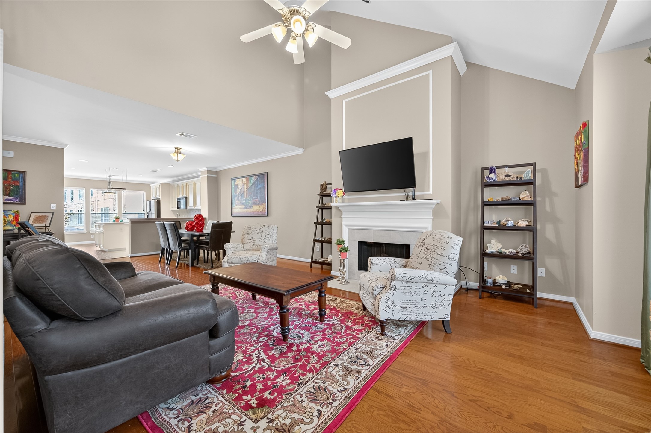 2913 West Dallas Street Houston, TX 77019 - Photo 2 of 34 a living room with furniture a fireplace and a flat screen tv