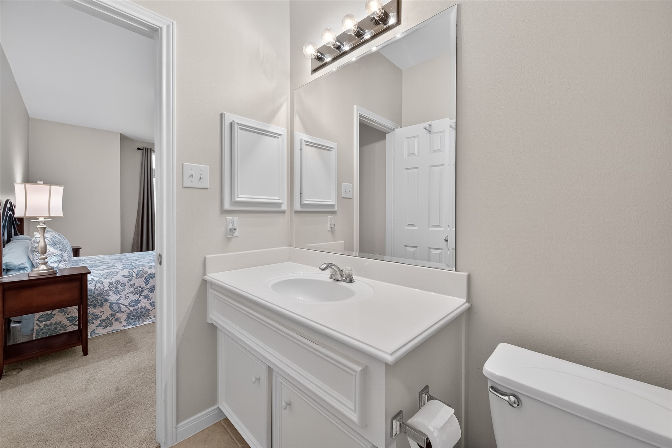 2913 West Dallas Street Houston, TX 77019 - Photo 21 of 34 a bathroom with a sink a toilet and a mirror
