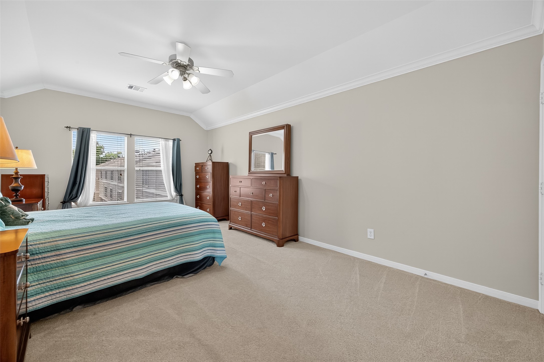 2913 West Dallas Street Houston, TX 77019 - Photo 23 of 34 a bedroom with a bed and a chandelier