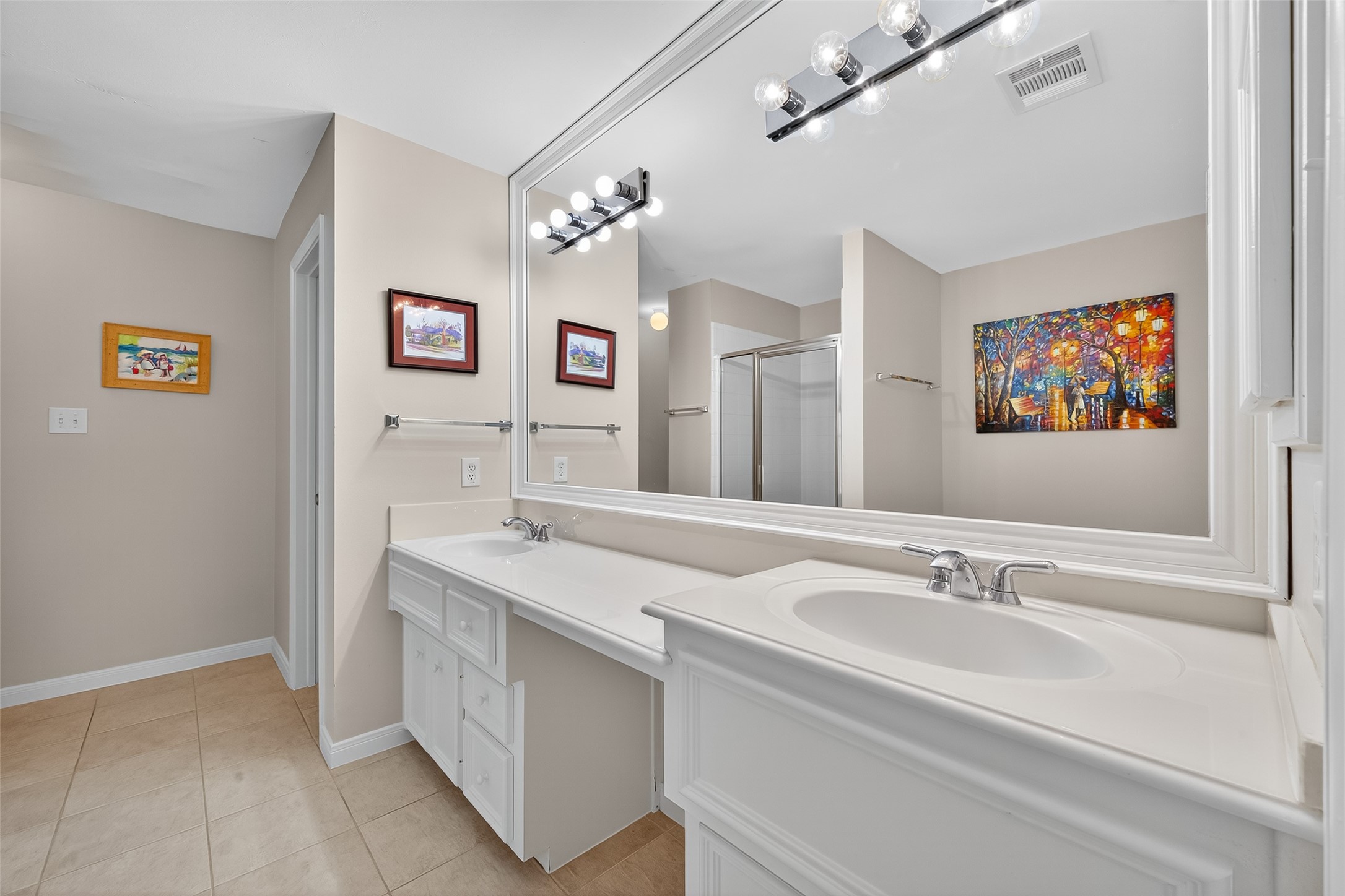 2913 West Dallas Street Houston, TX 77019 - Photo 27 of 34 a bathroom with a sink double vanity and a mirror