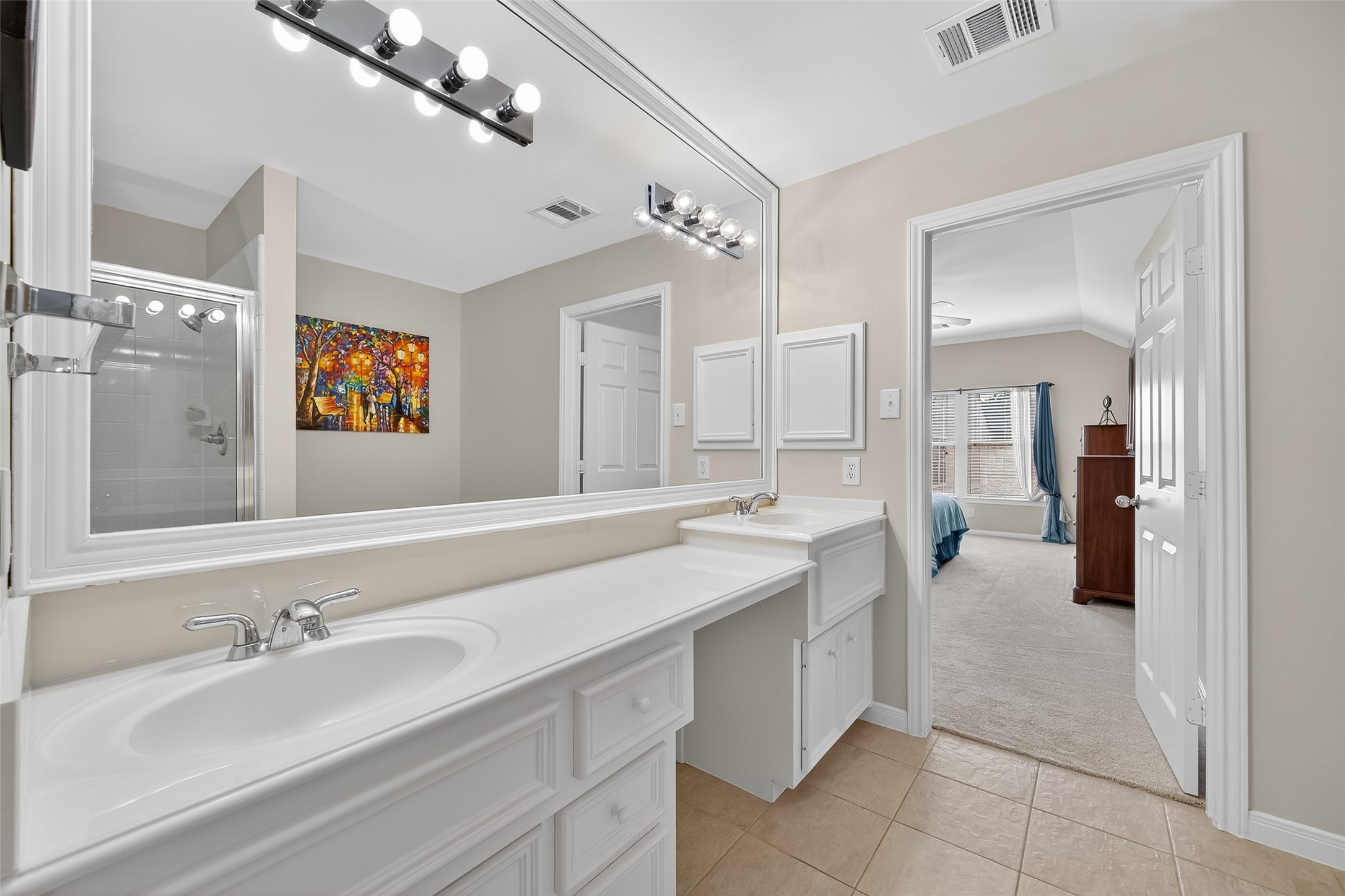2913 West Dallas Street Houston, TX 77019 - Photo 31 of 34 a bathroom with a sink double vanity and a mirror