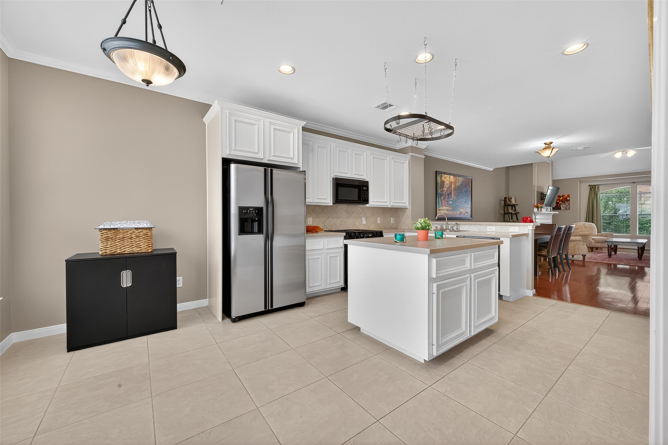 2913 West Dallas Street Houston, TX 77019 - Photo 5 of 34 a open kitchen with cabinets and stainless steel appliances