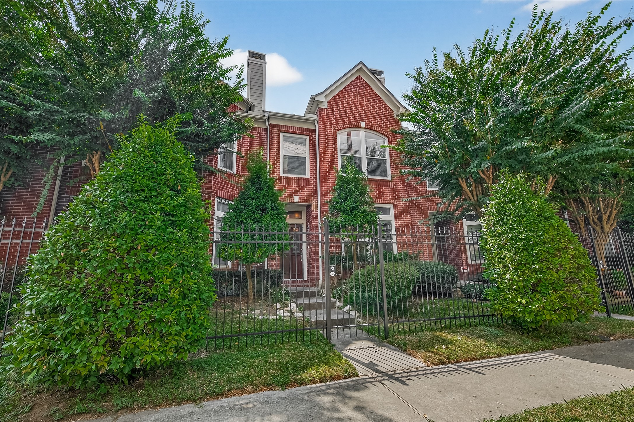 2913 West Dallas Street Houston, TX 77019 - Photo 6 of 34 a front view of a house with a yard