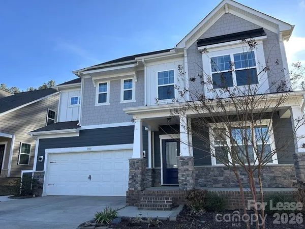 a front view of a house with a garage
