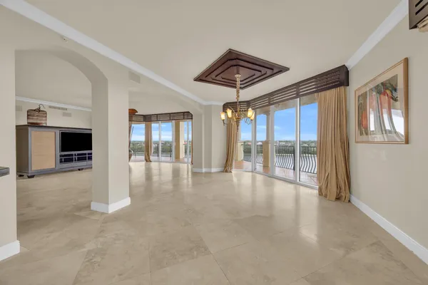 a view of a livingroom with wooden floor and a flat screen tv