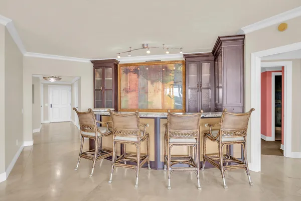 an empty room with ceiling fan and window