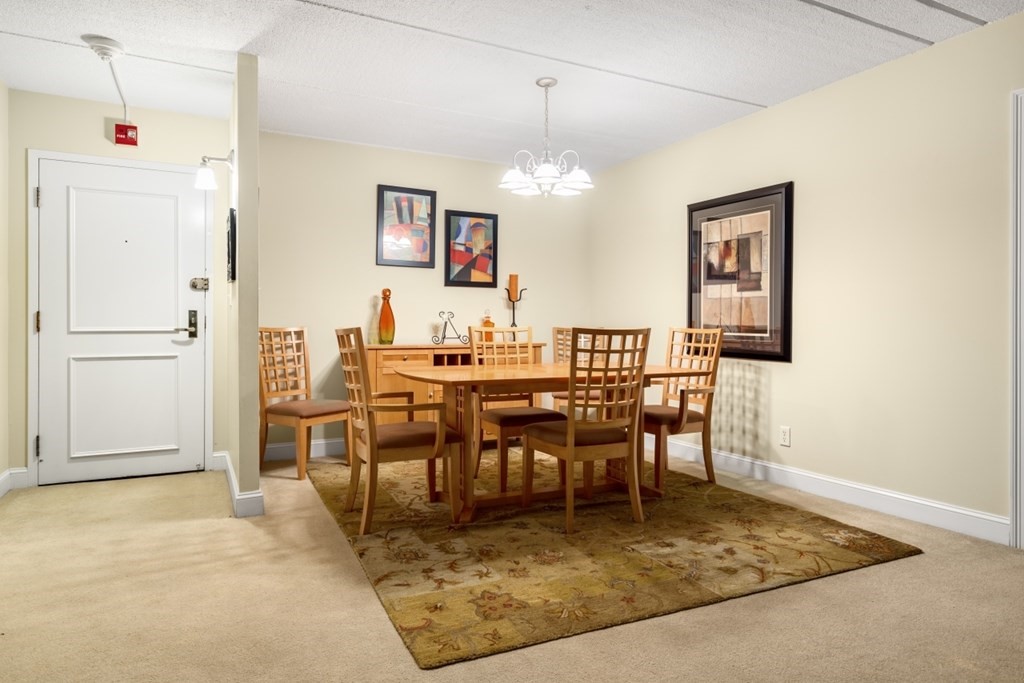 1500 Worcester Road, Unit 321 Framingham, MA 01702 - Photo 14 of 42 a view of a dining room with furniture