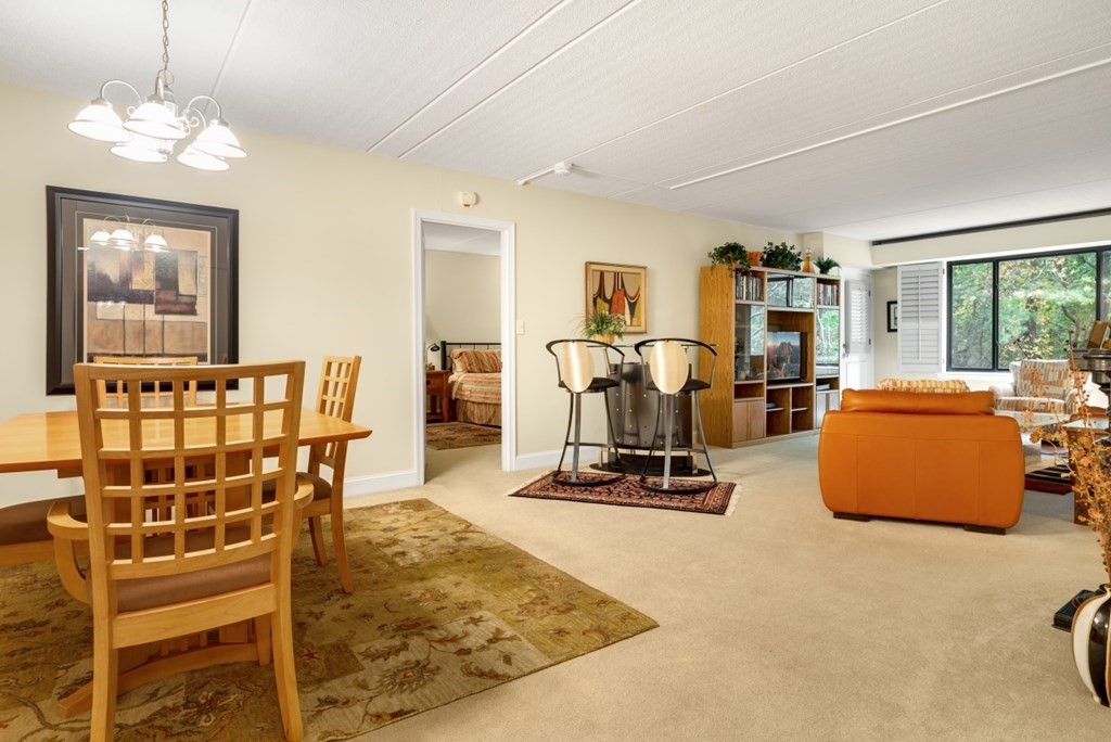 1500 Worcester Road, Unit 321 Framingham, MA 01702 - Photo 16 of 42 a bedroom with furniture and a window