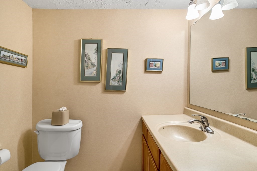 1500 Worcester Road, Unit 321 Framingham, MA 01702 - Photo 26 of 42 a bathroom with a sink and a mirror