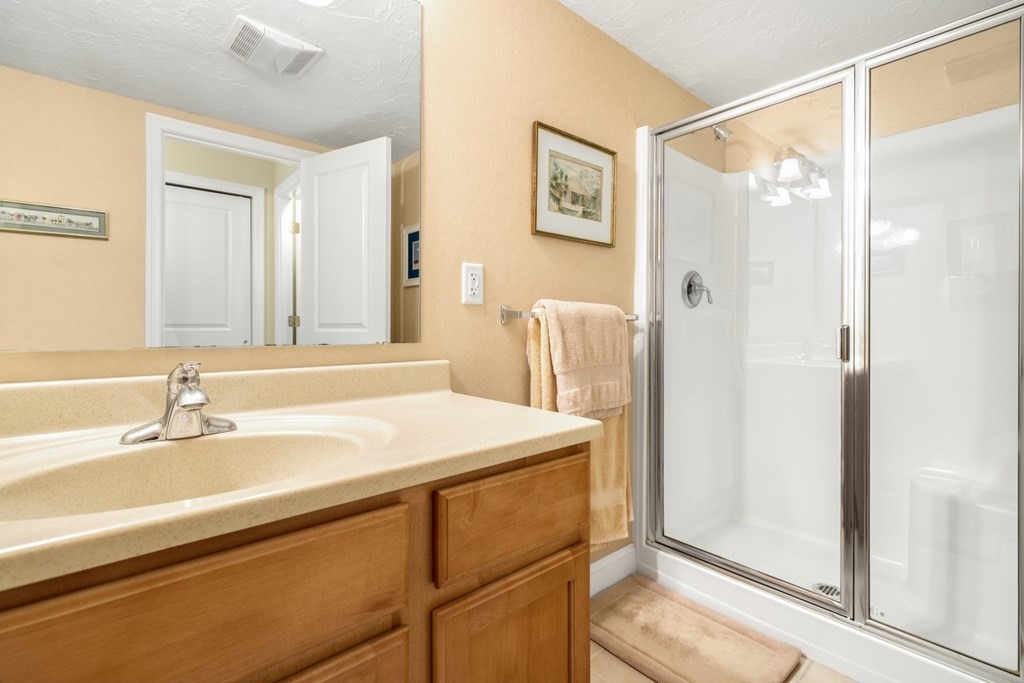 1500 Worcester Road, Unit 321 Framingham, MA 01702 - Photo 27 of 42 a bathroom with a sink and a mirror