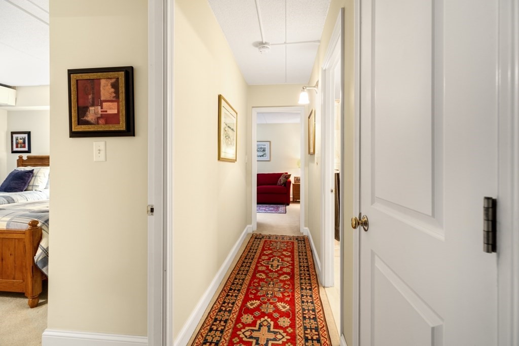 1500 Worcester Road, Unit 321 Framingham, MA 01702 - Photo 28 of 42 a view of a hallway with wooden floor and closet