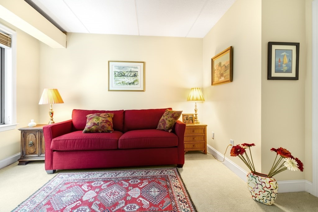 1500 Worcester Road, Unit 321 Framingham, MA 01702 - Photo 30 of 42 a living room with furniture and a couch