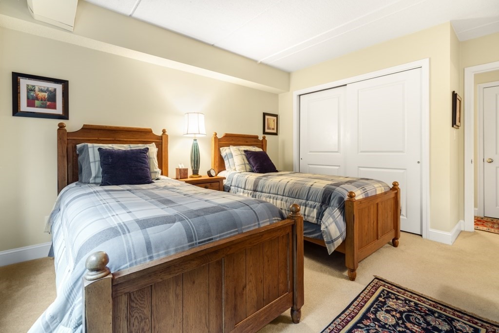 1500 Worcester Road, Unit 321 Framingham, MA 01702 - Photo 32 of 42 a bedroom with double bed and a window