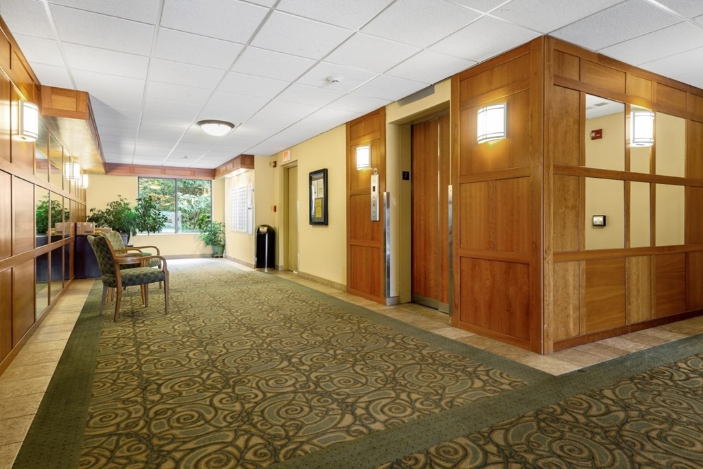 1500 Worcester Road, Unit 321 Framingham, MA 01702 - Photo 5 of 42 a living room with furniture