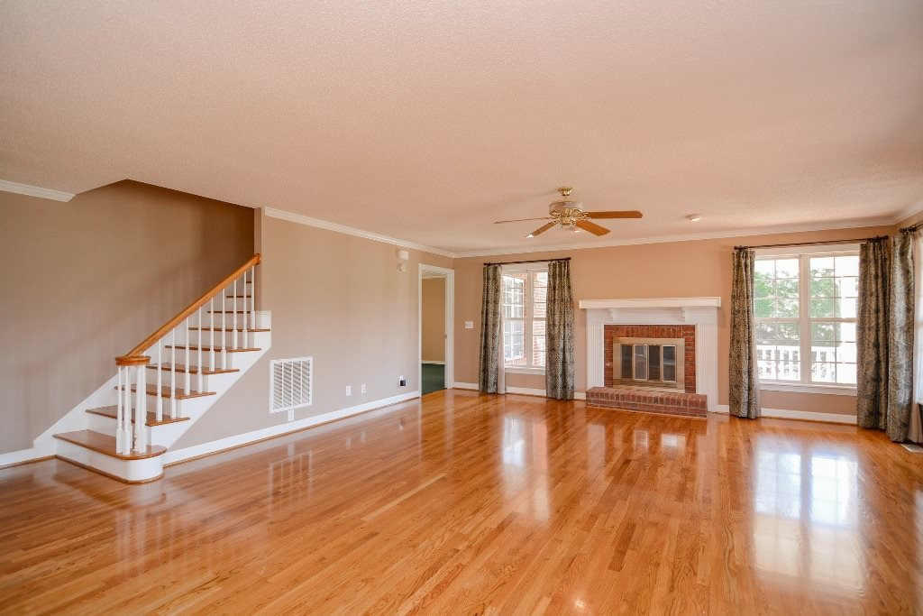 9798 Covered Bridge Road Zebulon, NC 27597 - Photo 6 of 25 Gleaming hardwood floors and wood burning fireplace. Spacious Living room