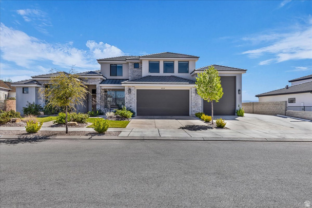404 North Marsala Way St. George, UT 84770 - Photo 1 of 26 Prairie-style home featuring driveway, a garage, and stucco siding