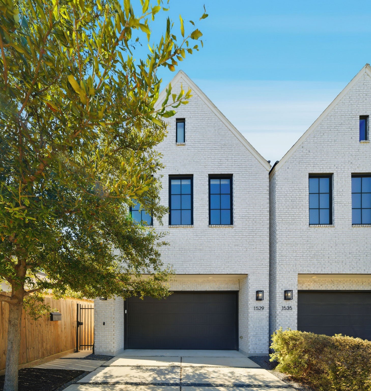 a house with a tree in front of it