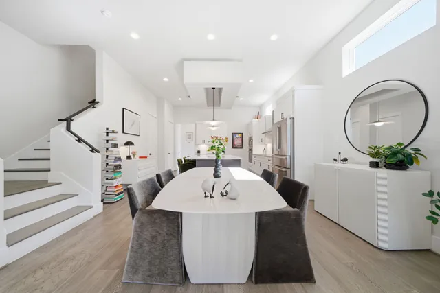 a living room with furniture and a mirror