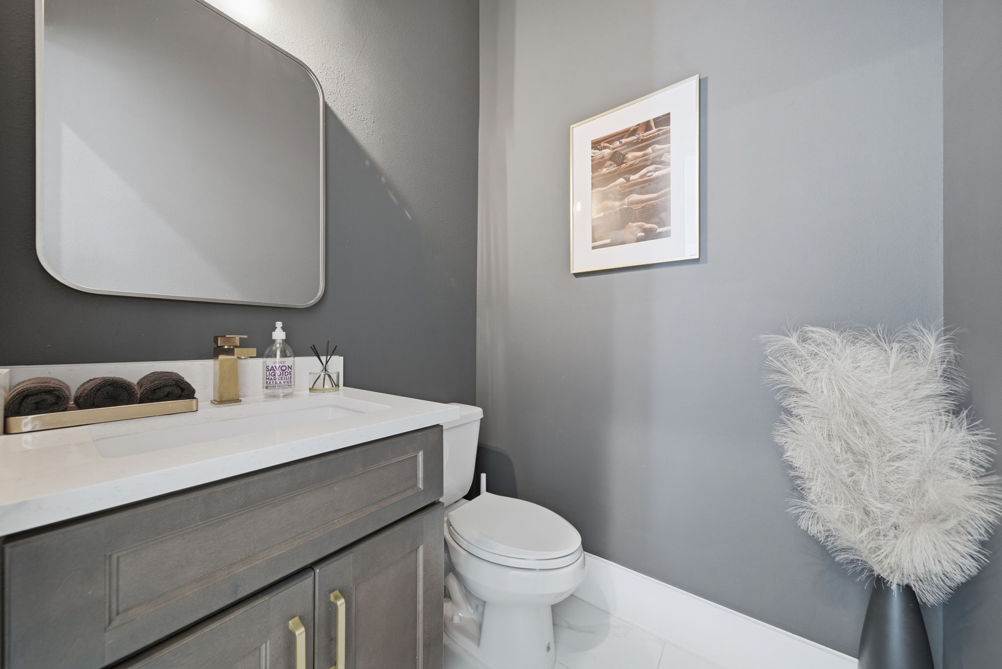 1529 Laird Street Houston, TX 77008 - Photo 13 of 31 a bathroom with a sink vanity mirror and toilet