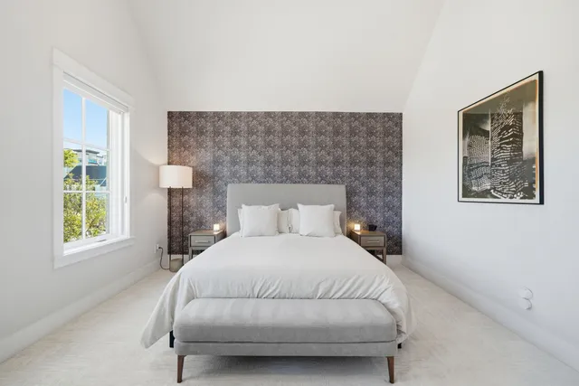 a bedroom with a bed and a couch