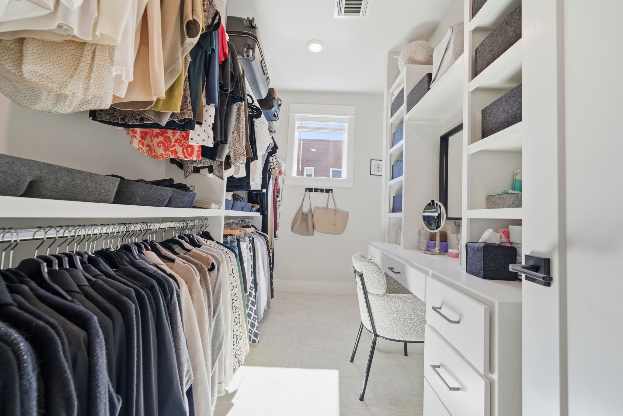 1529 Laird Street Houston, TX 77008 - Photo 18 of 31 a view of walk in closet with clothes and shoes