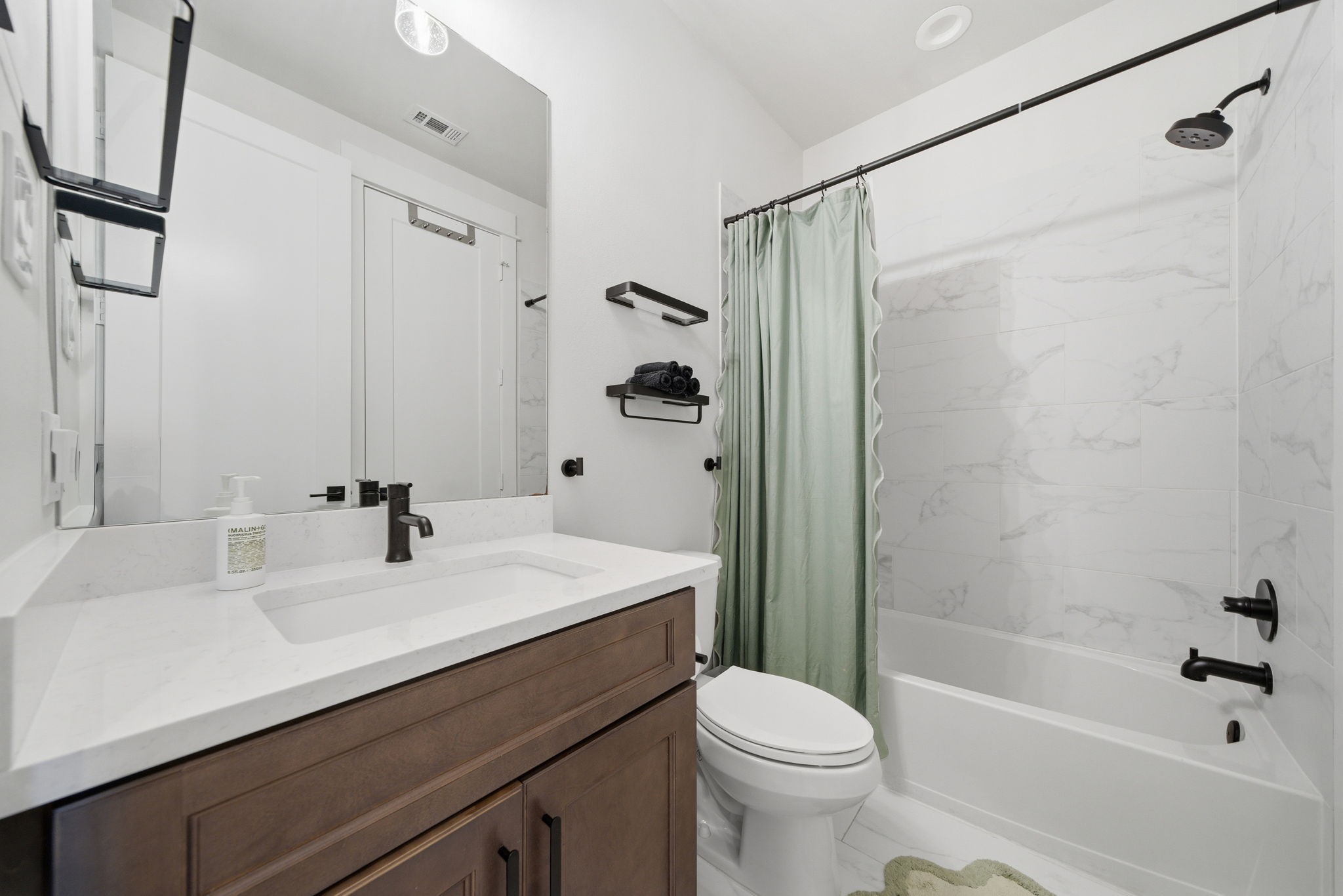 1529 Laird Street Houston, TX 77008 - Photo 28 of 31 a bathroom with a sink a toilet and shower