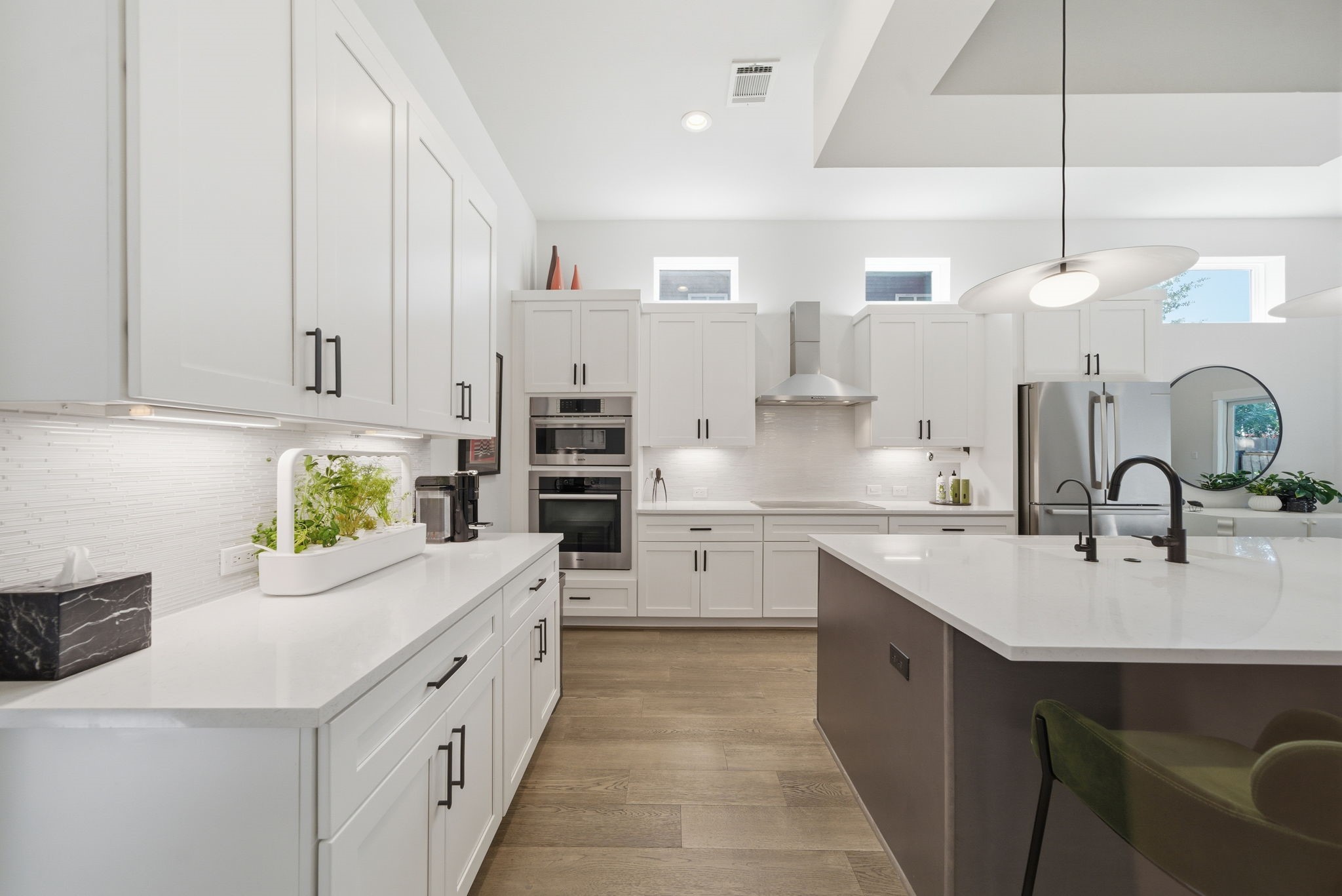 1529 Laird Street Houston, TX 77008 - Photo 8 of 31 a kitchen with kitchen island granite countertop a sink a counter space appliances and cabinets