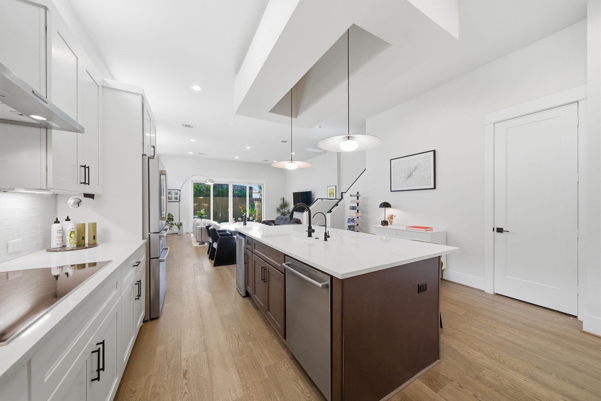 1529 Laird Street Houston, TX 77008 - Photo 9 of 31 a kitchen with a sink a stove and a wooden floors