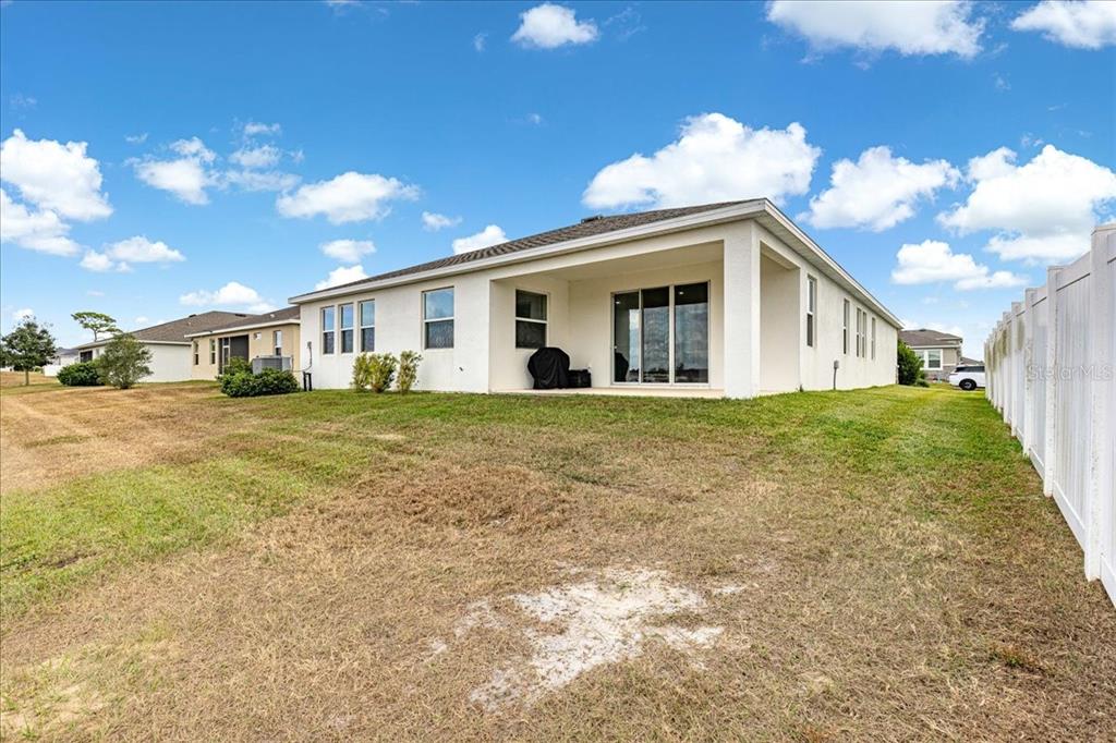 5851 Southwest 85th Place Ocala, FL 34476 - Photo 45 of 57 a view of a house with a yard